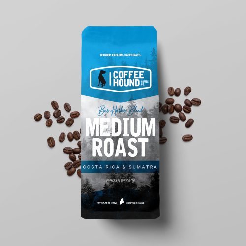 A bag of Coffee Hound's Bar Harbor Blend medium roast coffee, featuring a blend of Costa Rica and Sumatra beans with flavor notes of chocolate, honey, vanilla, and orange.